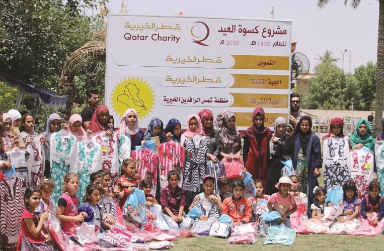 مستفيدون من مشروع كسوة العيد